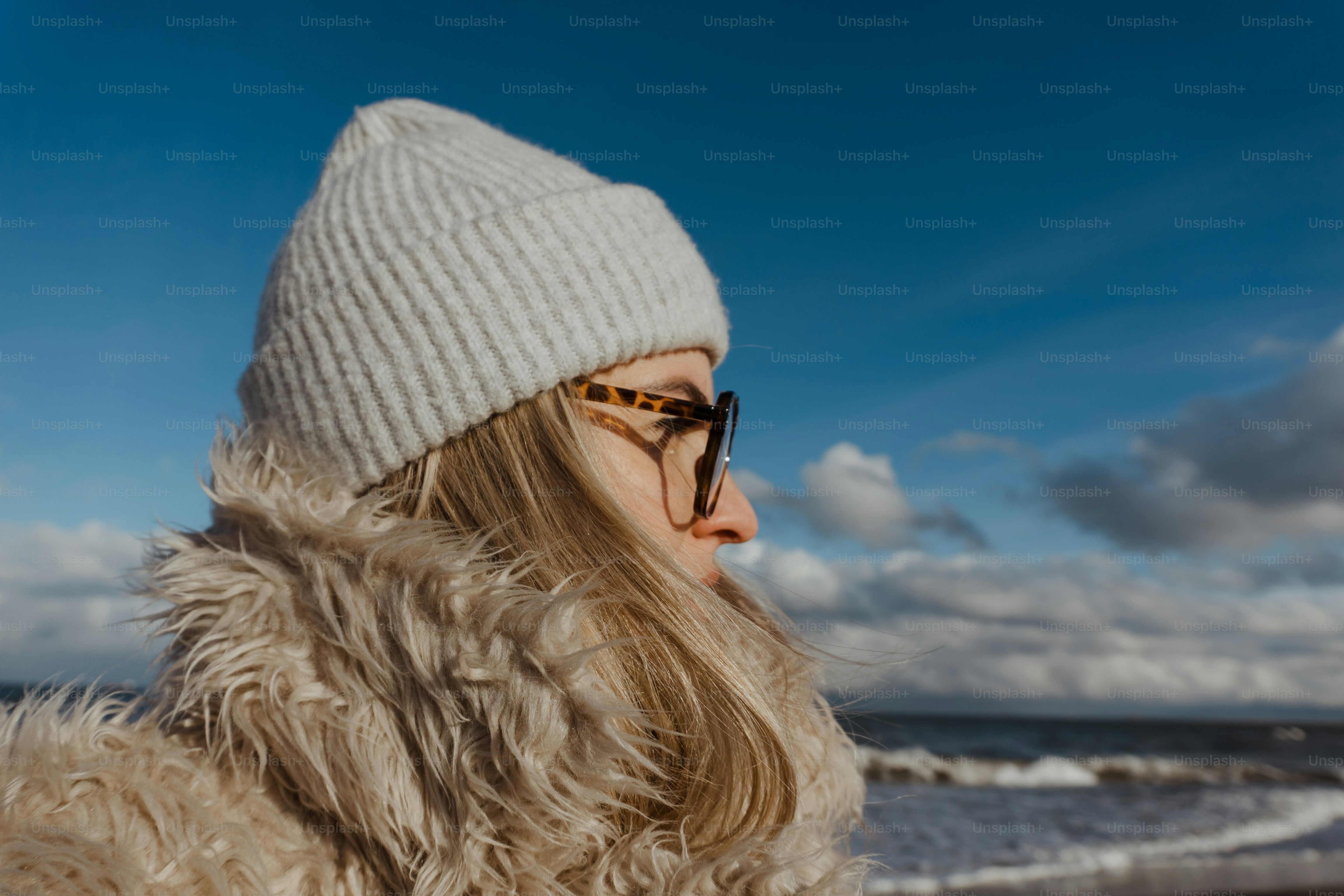 a woman wearing a white hat and glasses