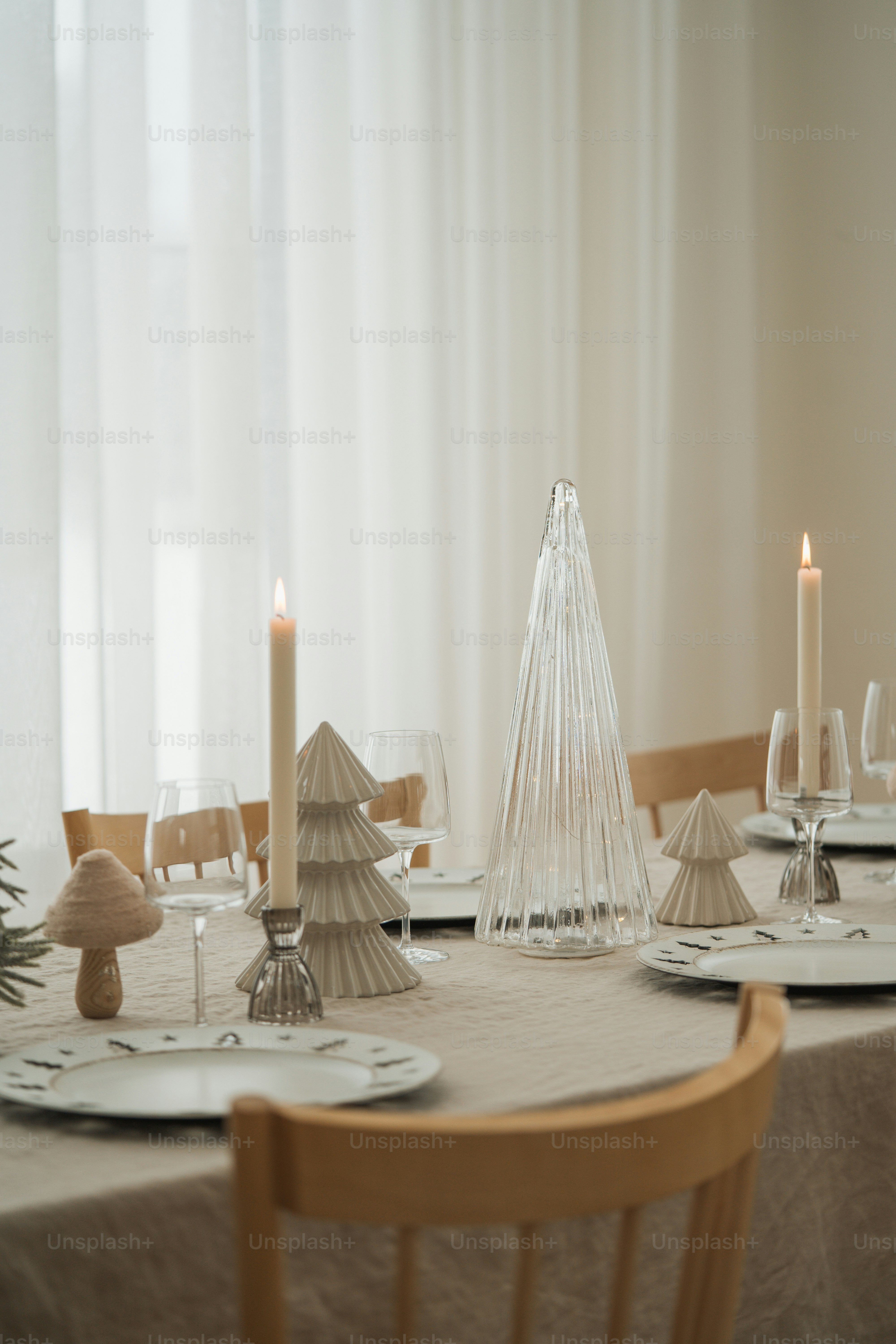 a dining room table set for christmas dinner