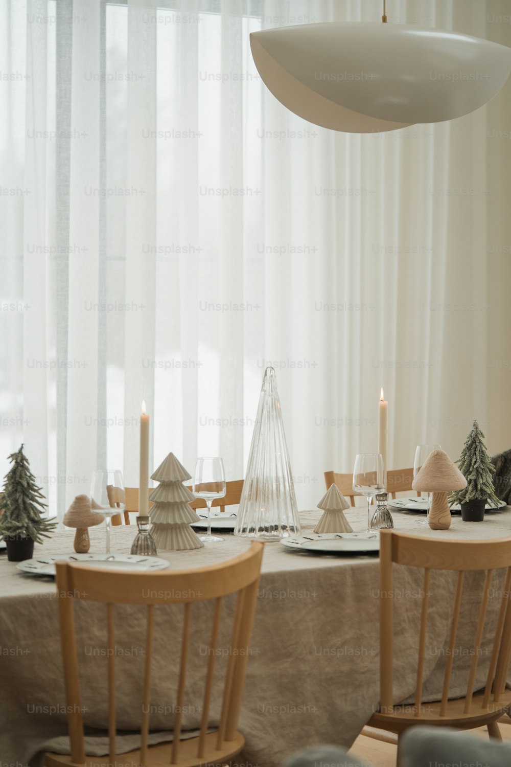 a dining room table set for christmas dinner
