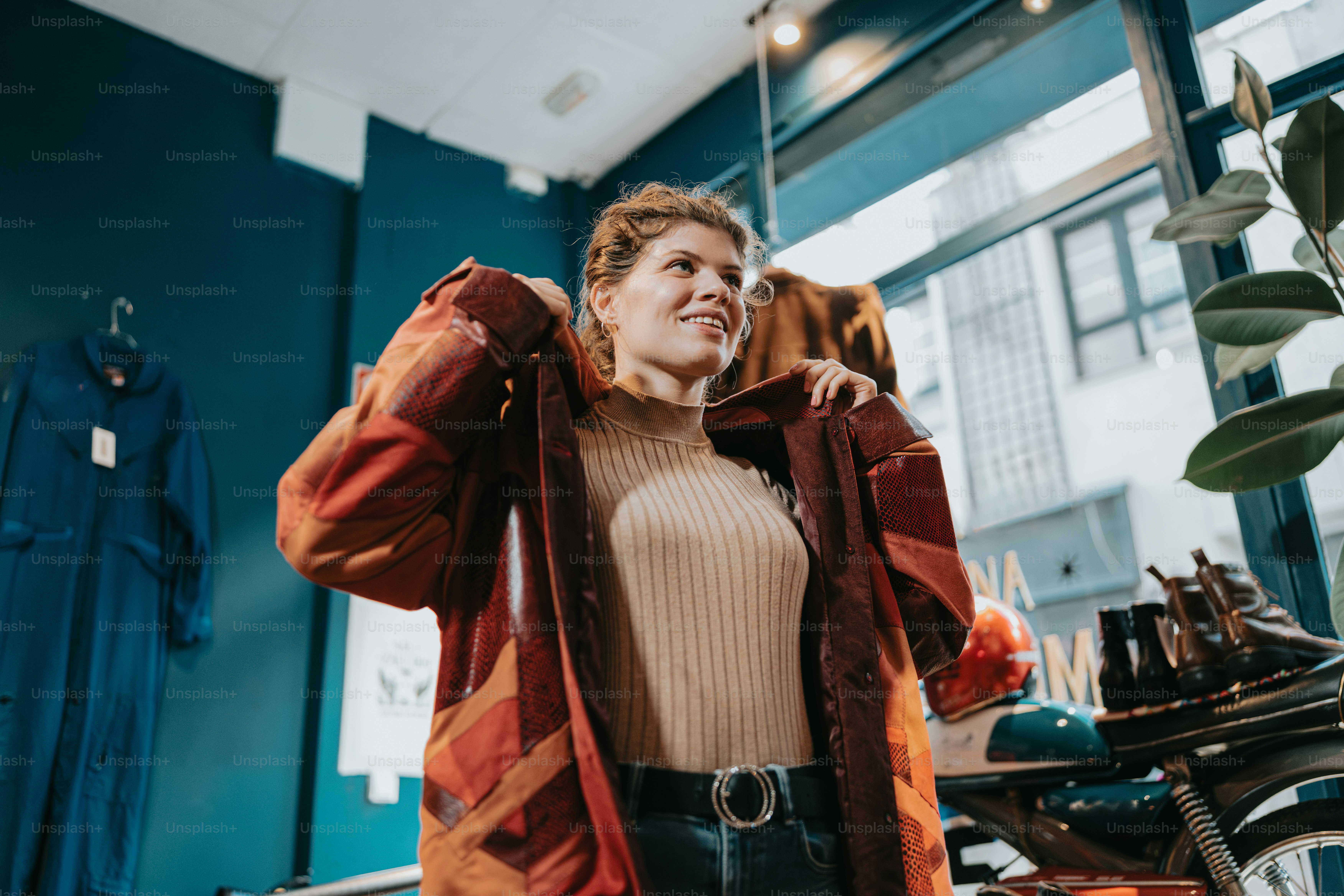 a woman standing next to a motorcycle in a room