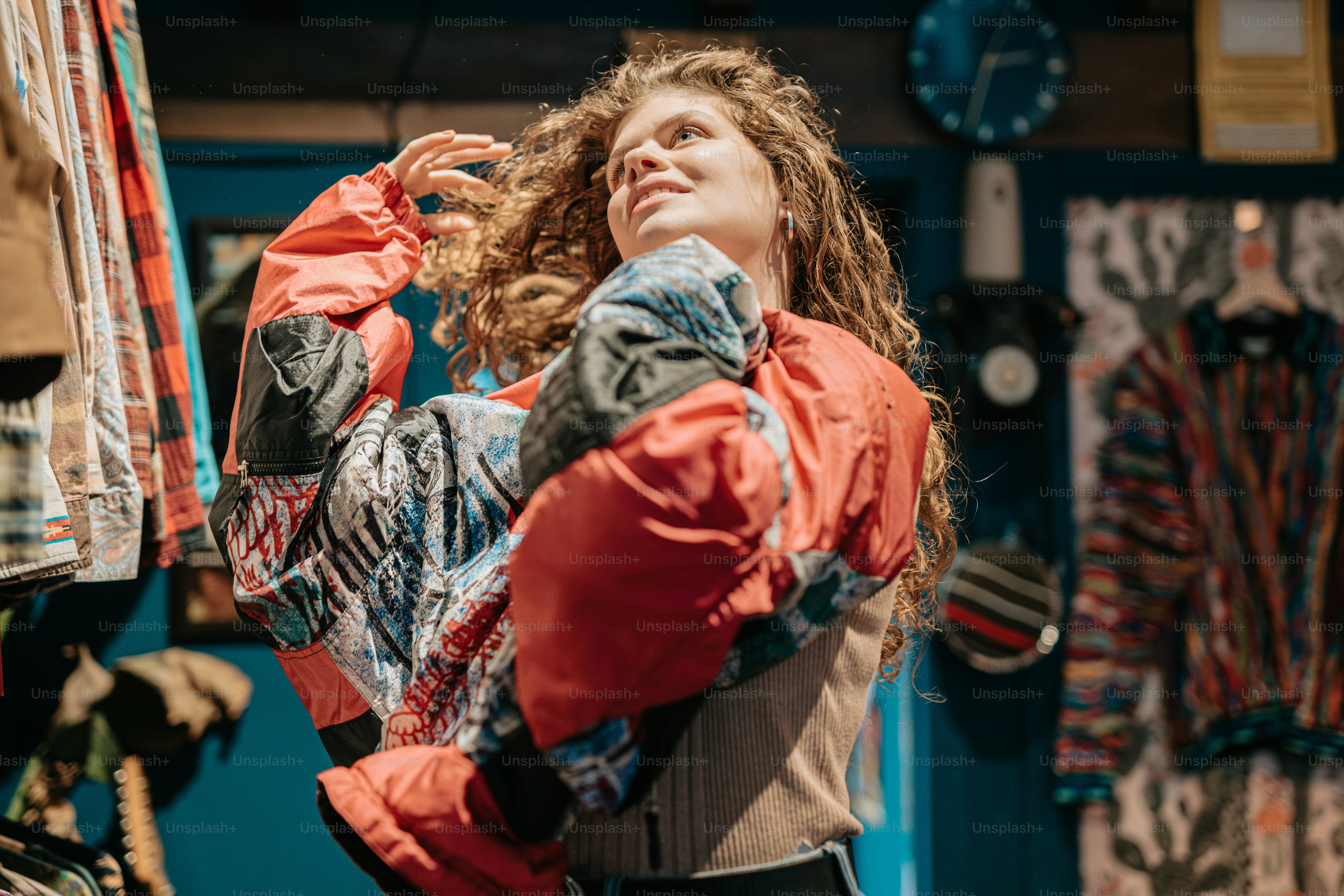 a woman with curly hair standing in a store