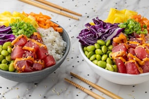 two bowls filled with different types of food