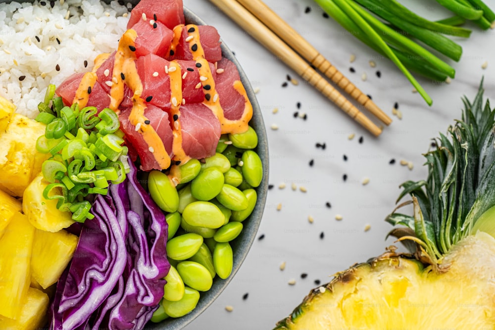 a bowl filled with rice, meat, and veggies