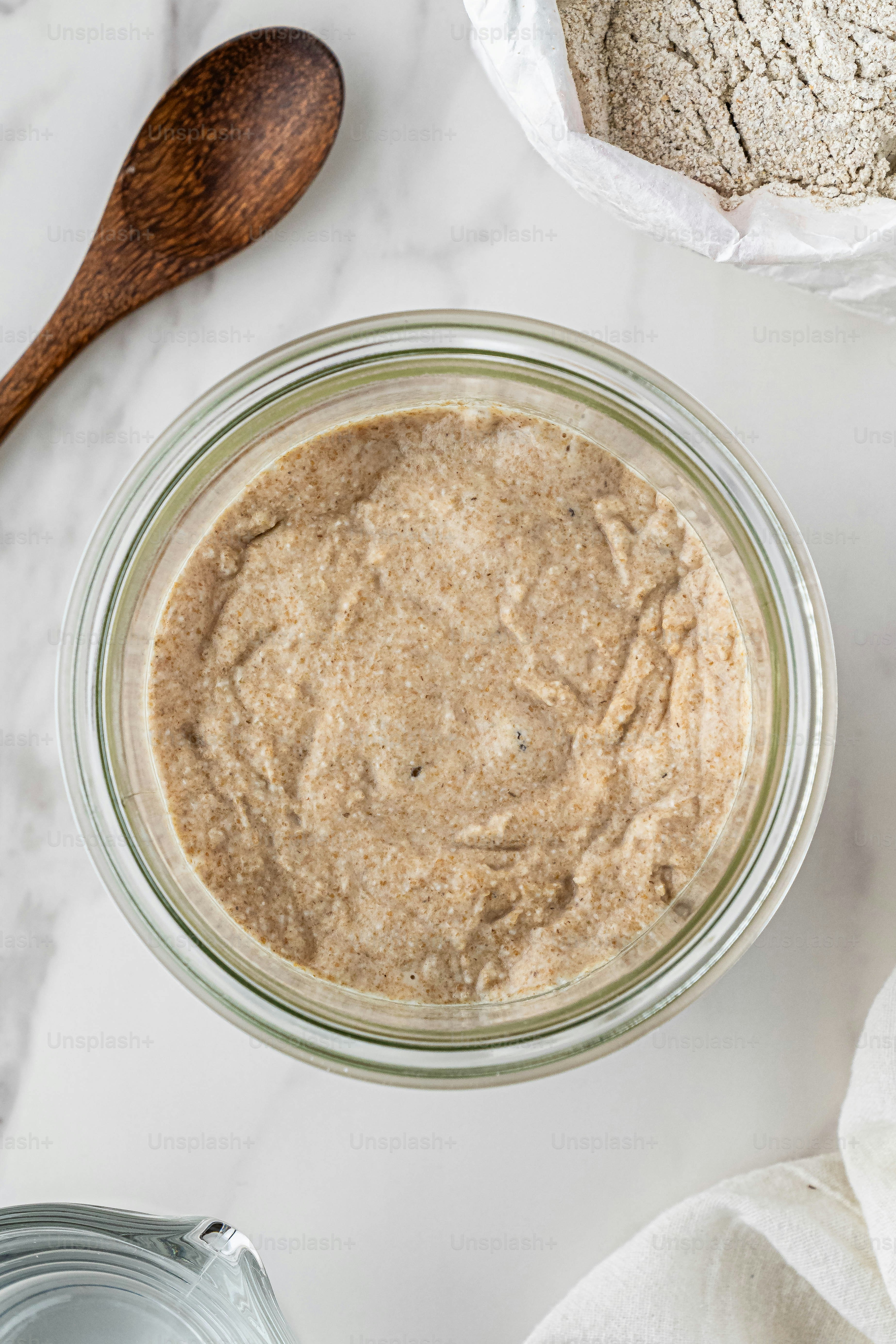 a jar of food sitting on top of a white counter