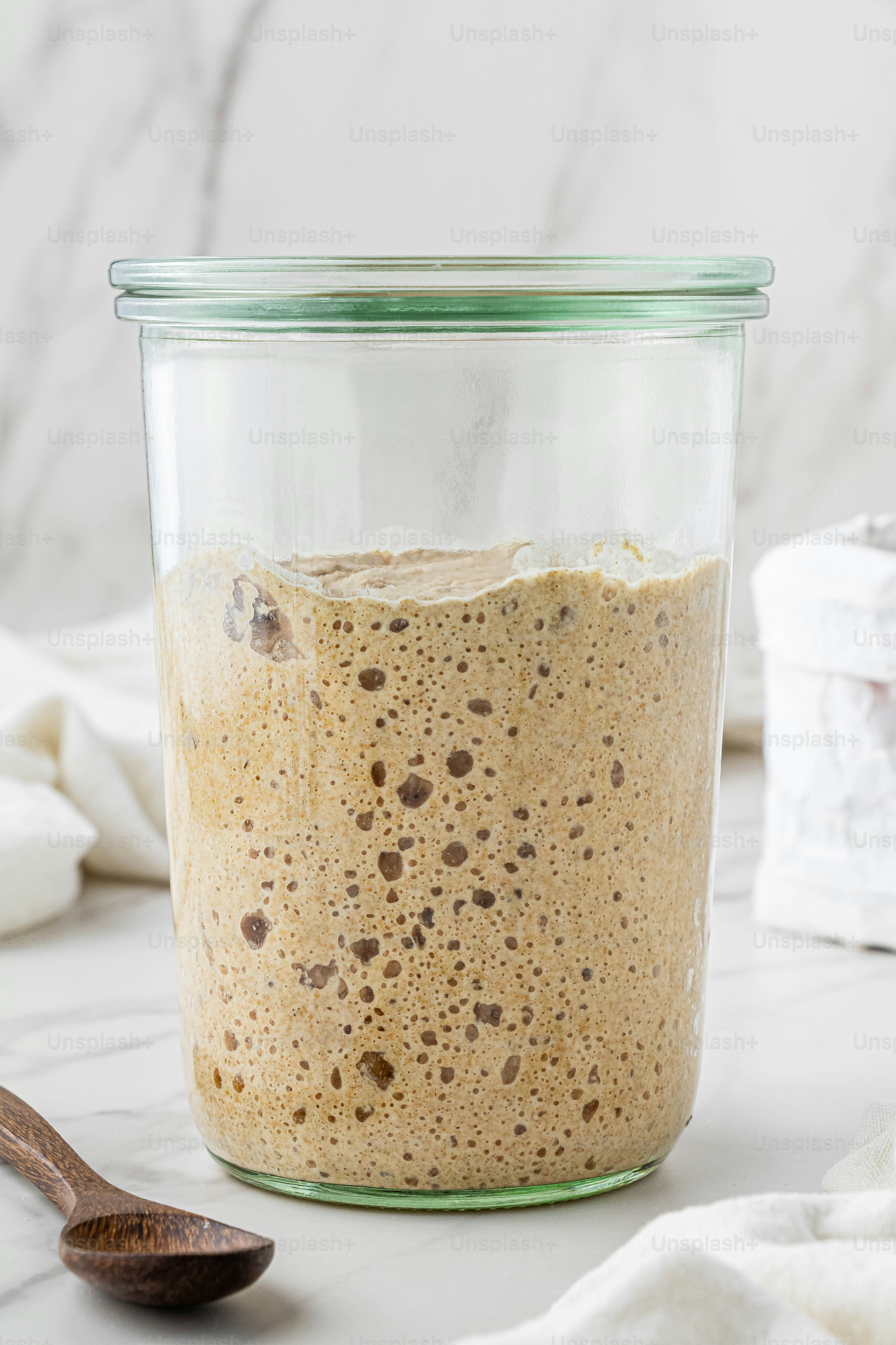 a glass jar filled with food sitting on top of a counter