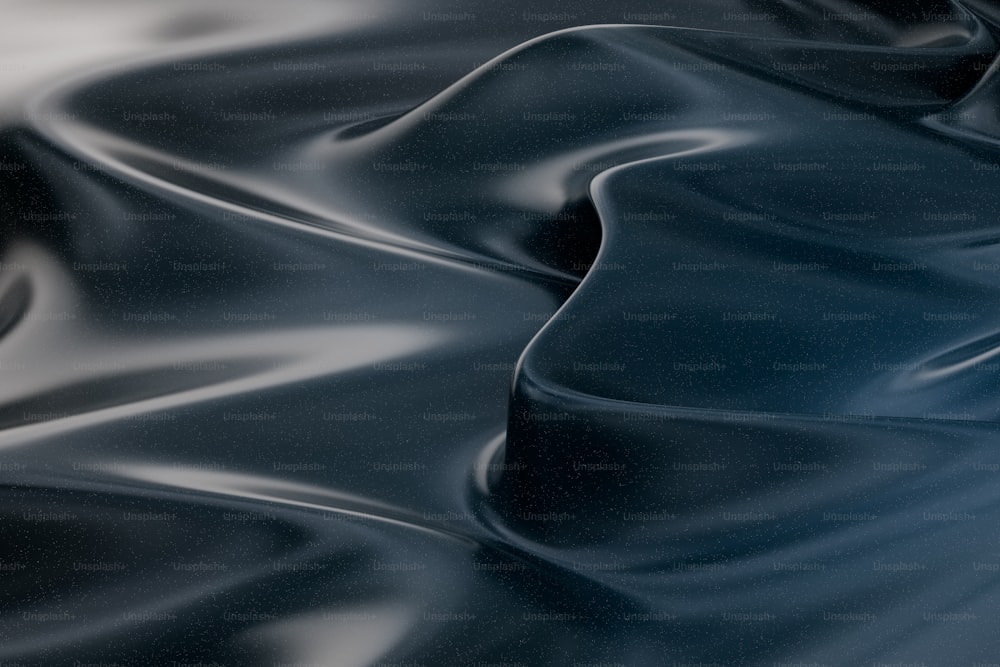 a black and white photo of a wavy fabric