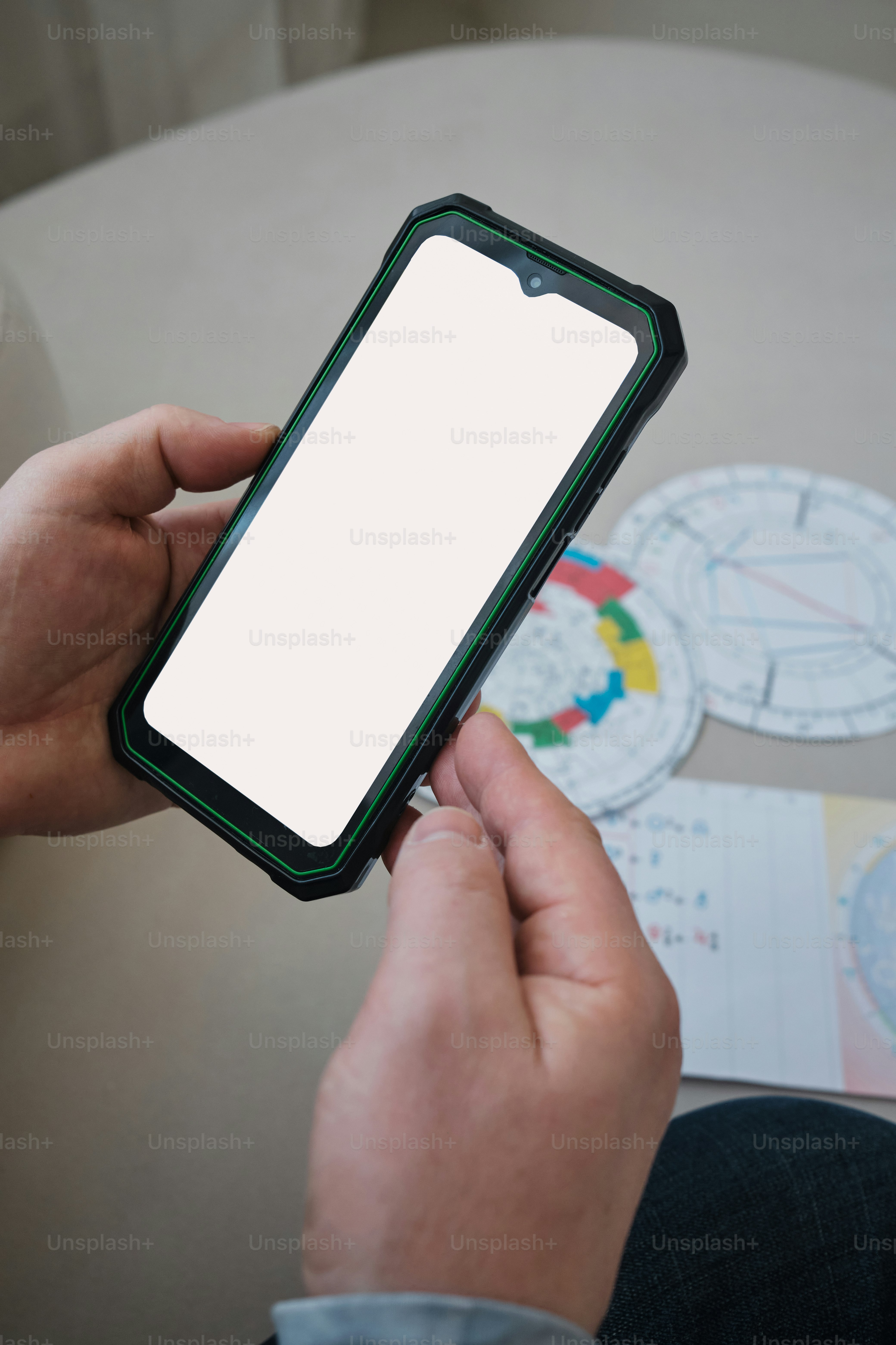 astrologer's hand with the mockup screen on the phone app