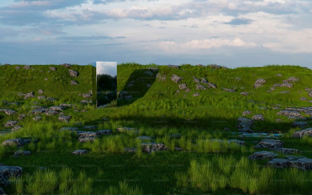 a grassy hill with a door in the middle of it