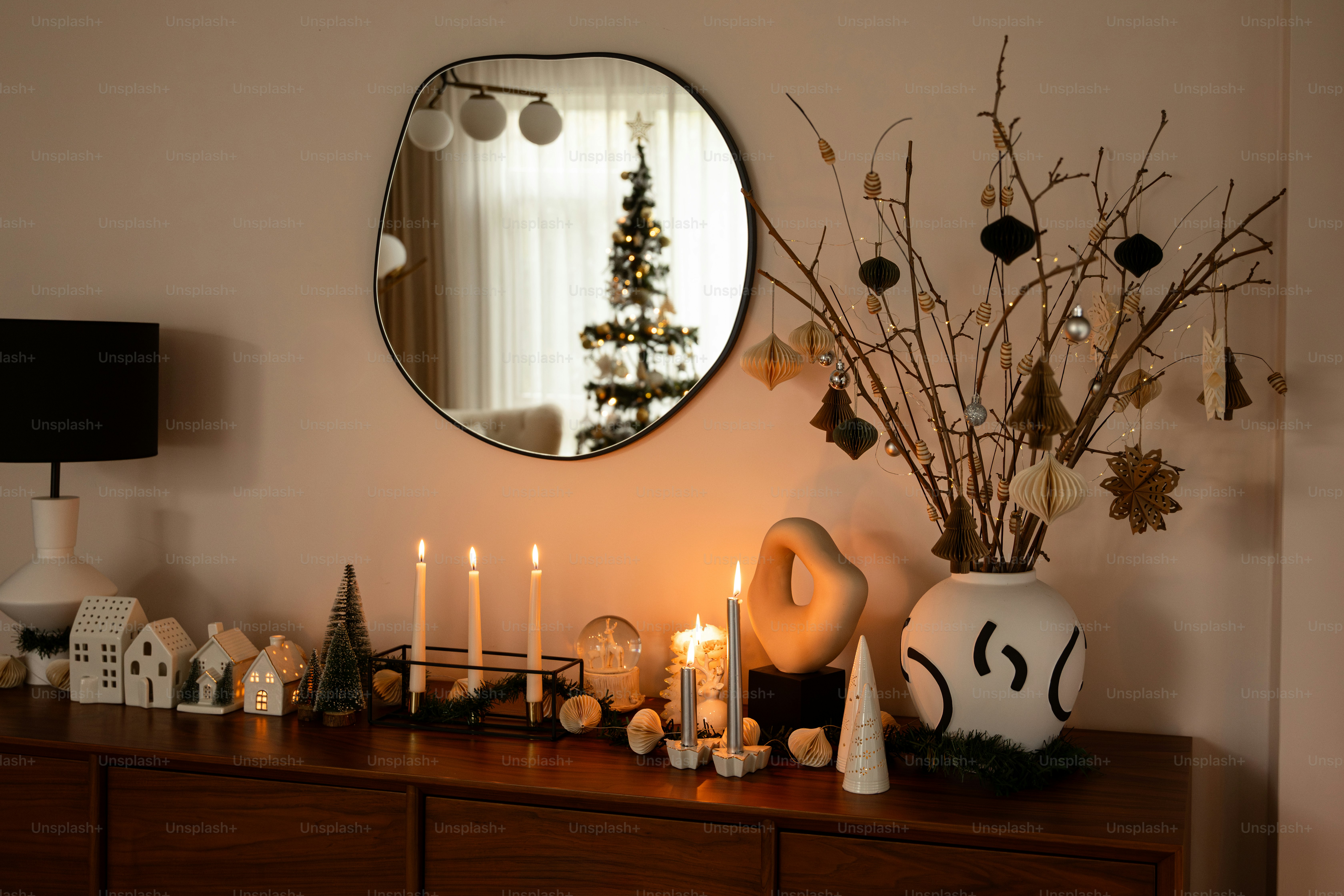 a table topped with a mirror and a bunch of candles