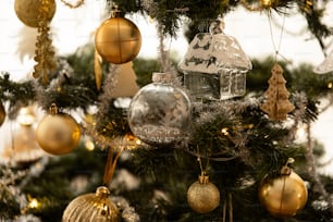 a close up of a christmas tree with ornaments