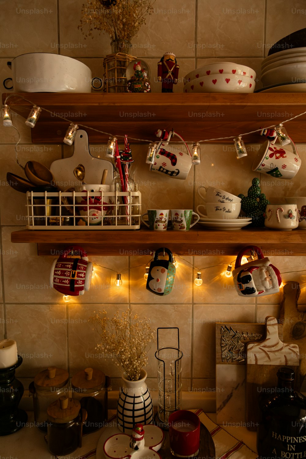 a shelf filled with dishes and cups on top of a kitchen counter