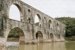 a large stone bridge over a body of water