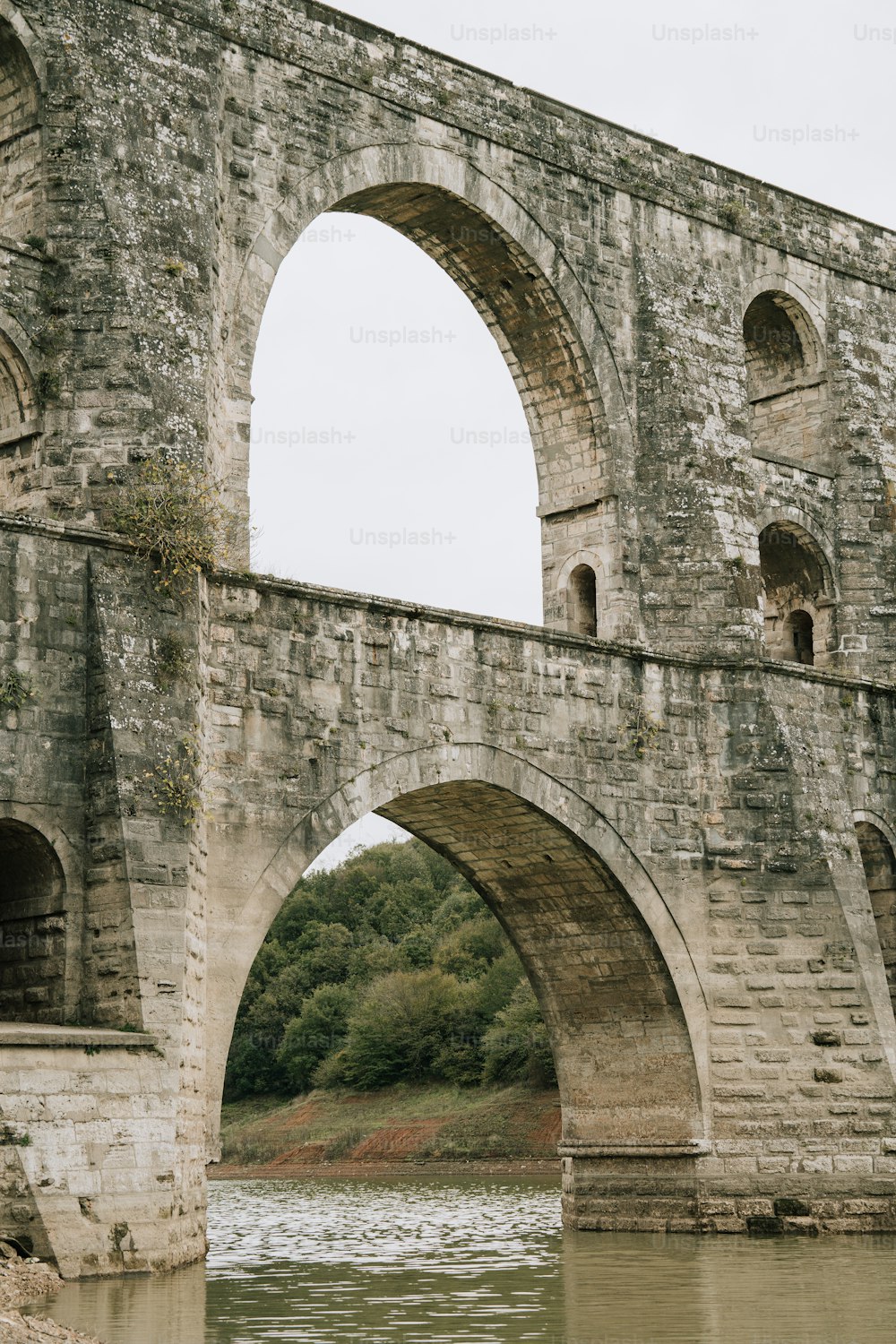 a stone bridge over a body of water