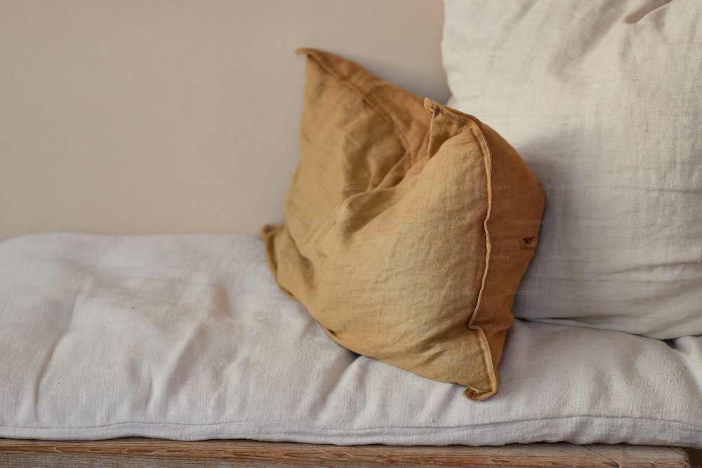 a close up of a pillow on a bed
