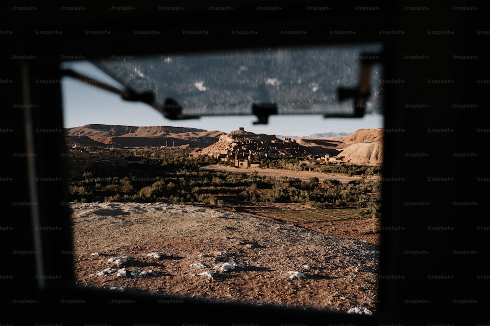 a view of a mountain range from a window