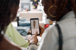 a woman holding a smart phone in her hand