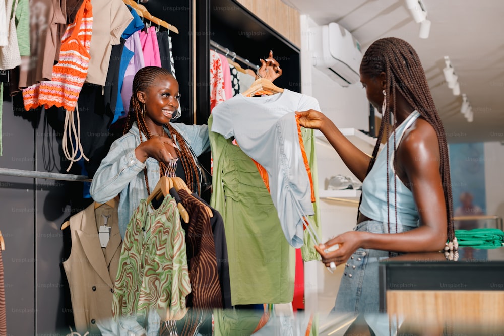 two women looking at clothes in a clothing store