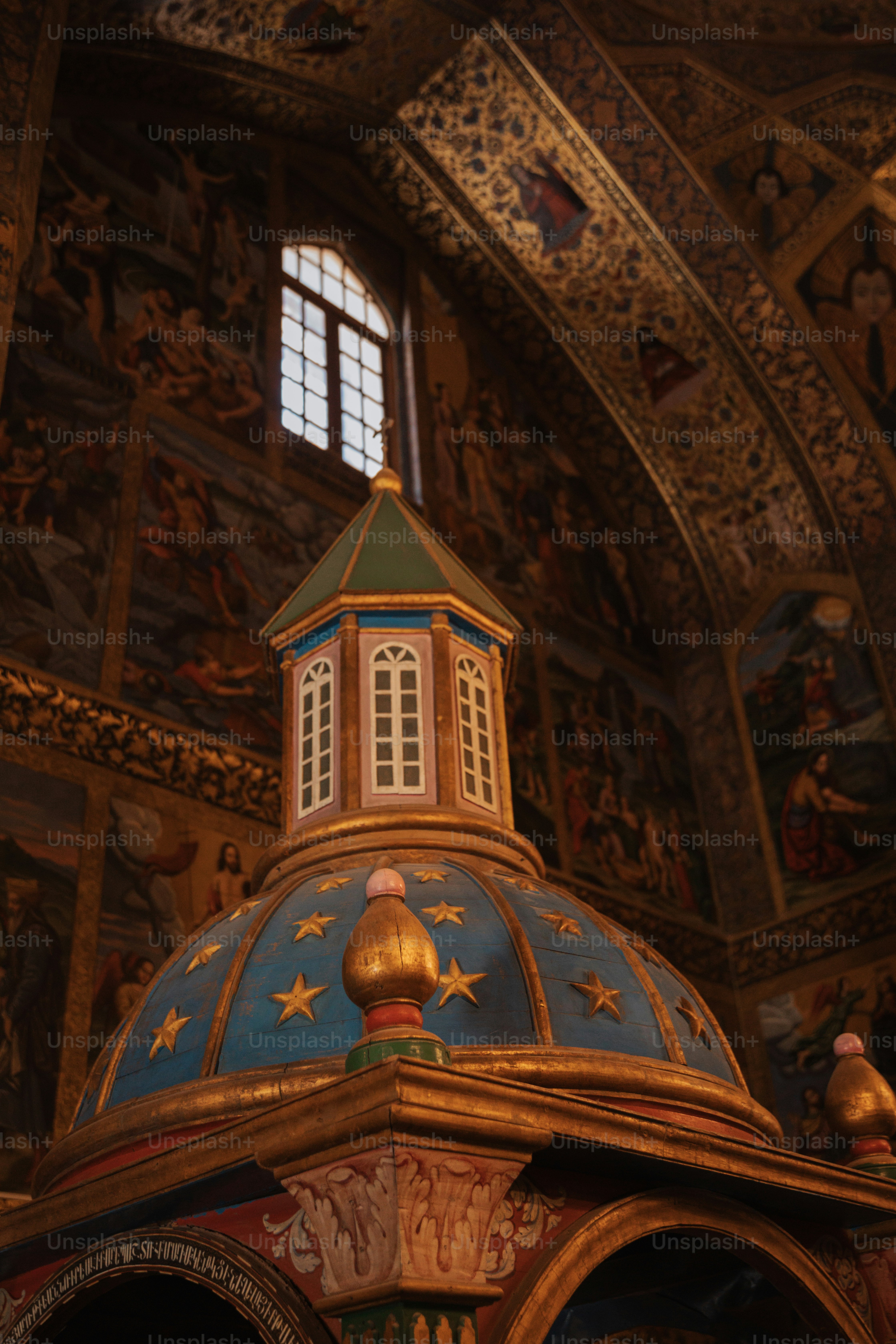 an ornate building with a clock on the top of it