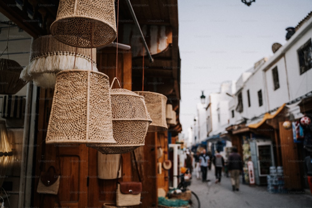 a group of baskets hanging from the side of a building