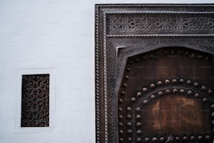 a close up of a metal door with a window