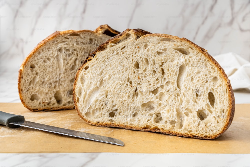 a close up of a piece of bread with a knife