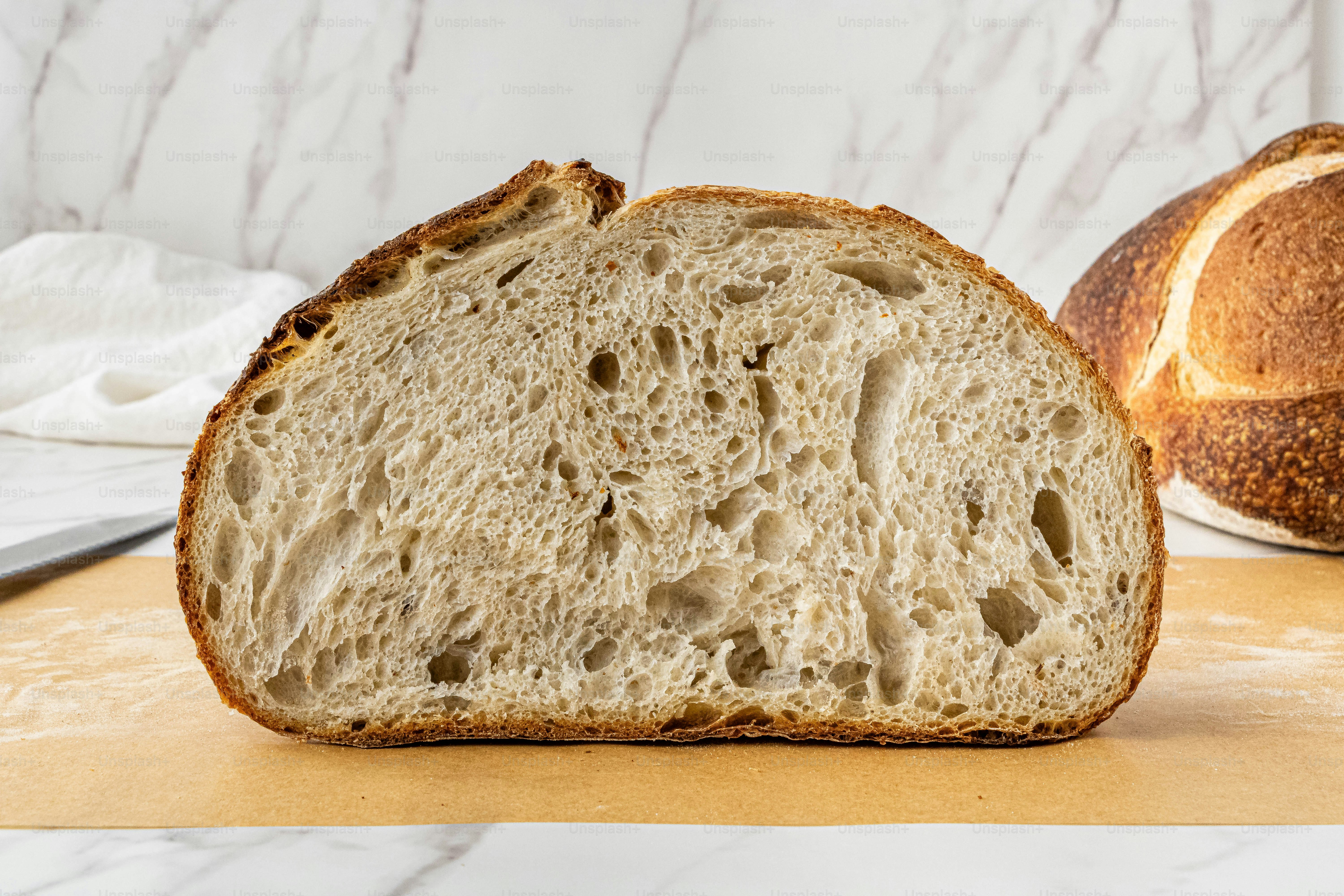 a loaf of bread sitting on top of a cutting board