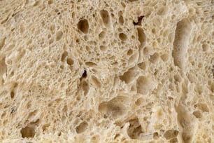 a close up of a piece of bread with holes in it