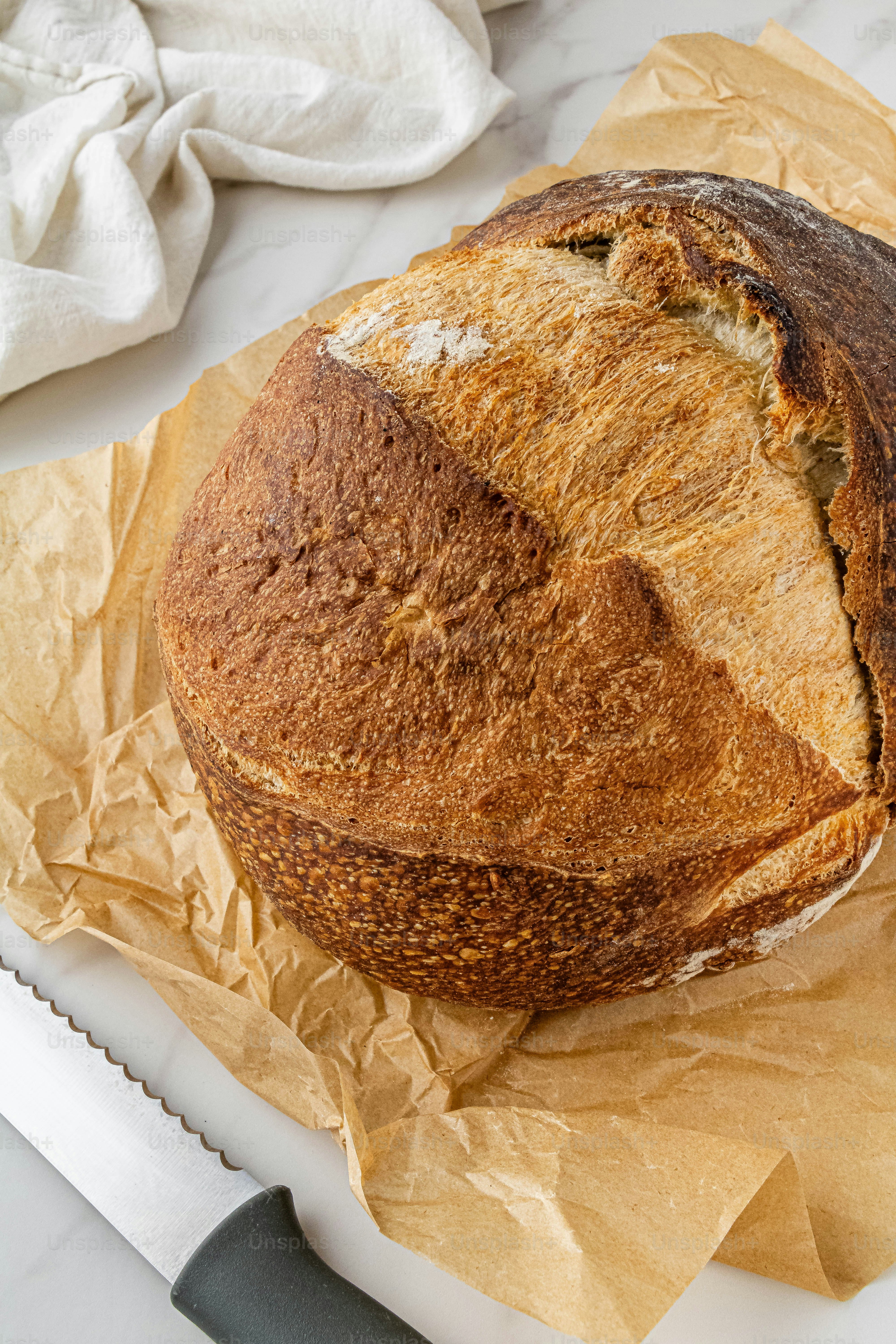 a loaf of bread sitting on top of a cutting board