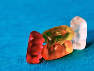 a couple of gummy bears sitting next to each other