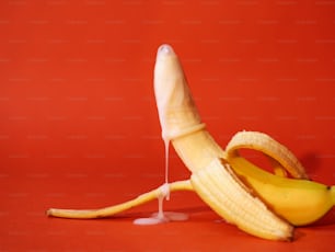 a peeled banana sitting on top of a table