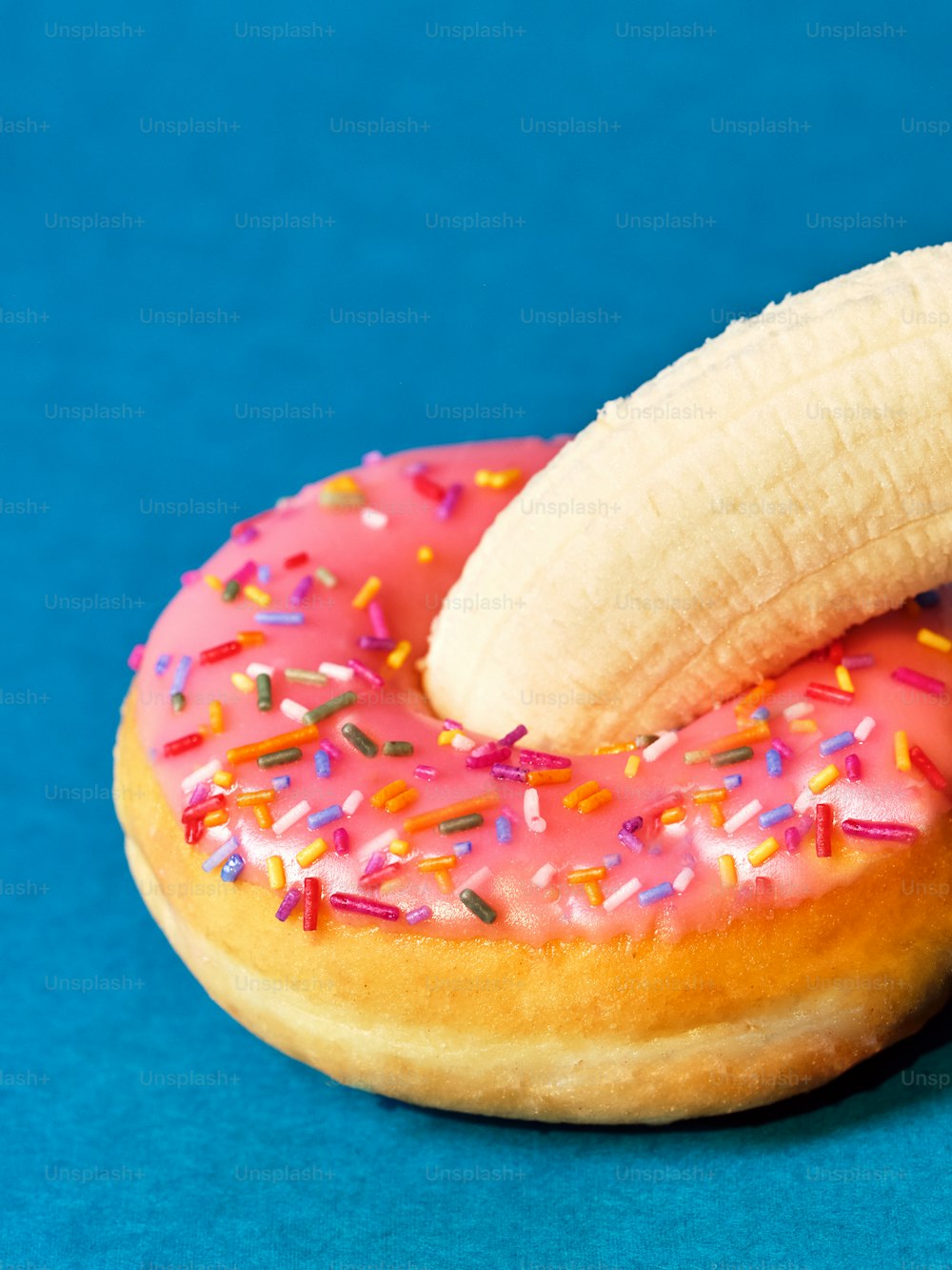 a pink donut with a bite taken out of it