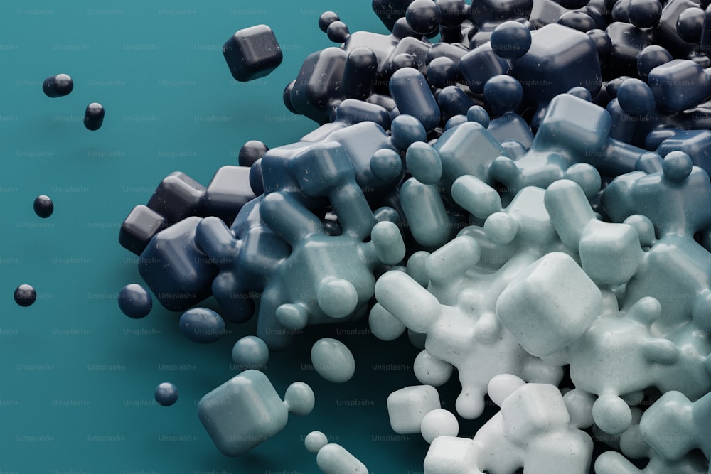 a pile of white and blue candies on a blue surface