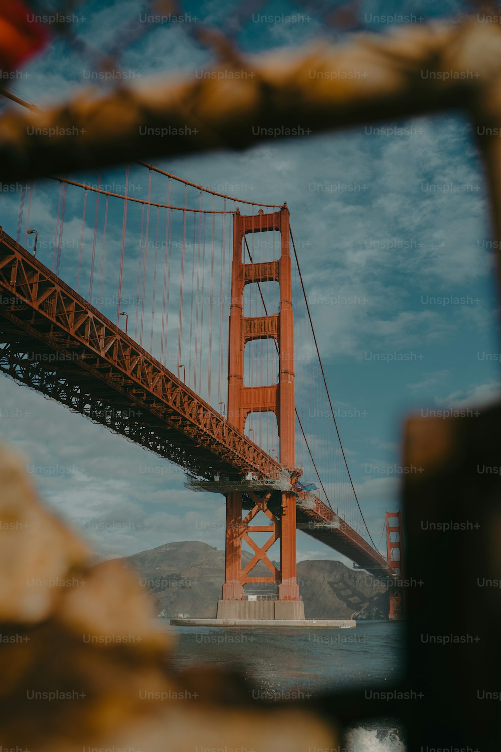 a view of the golden gate bridge through a mirror