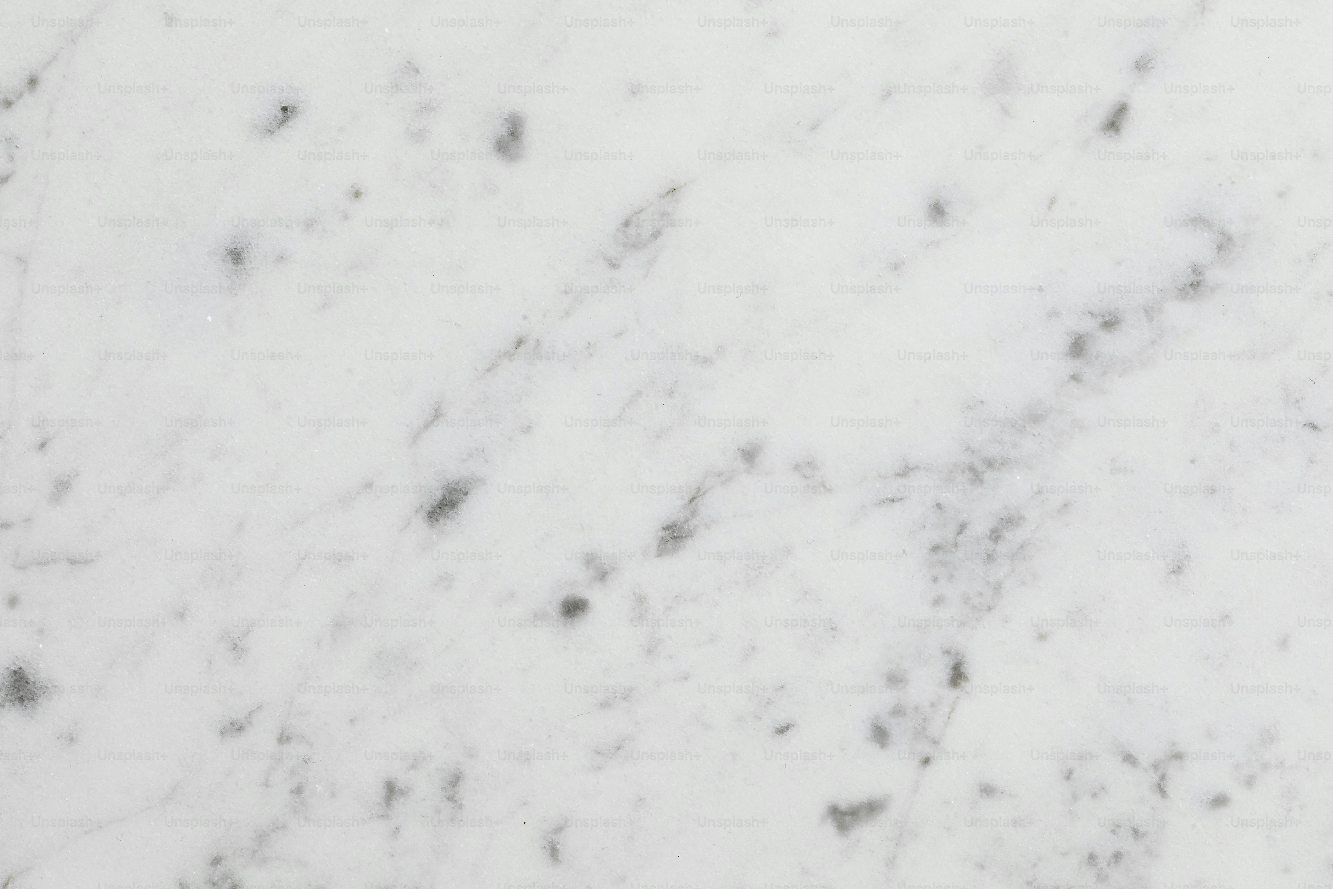 a close up of a white marble surface