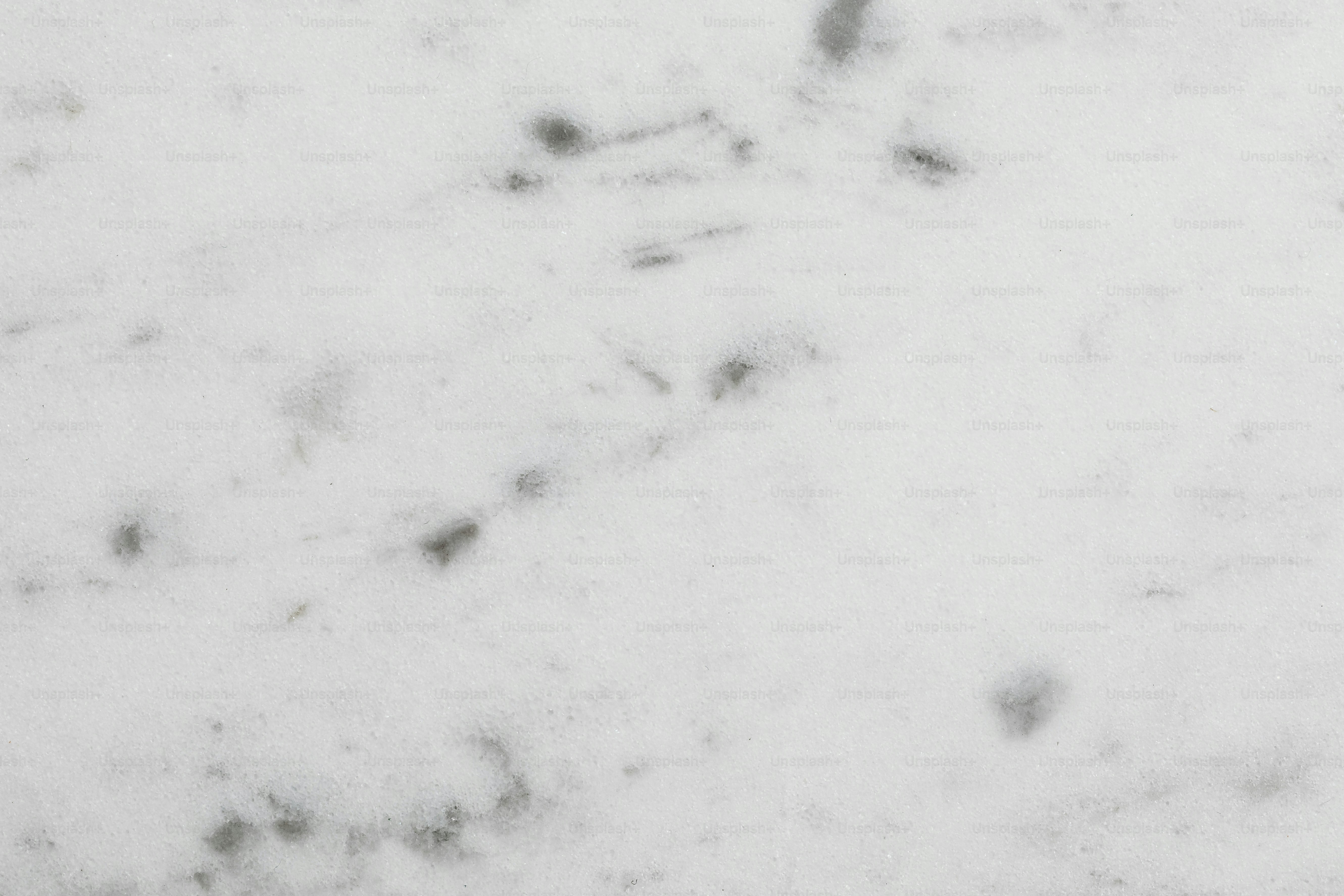 a close up of a white marble surface