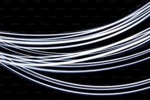 a black background with white light streaks