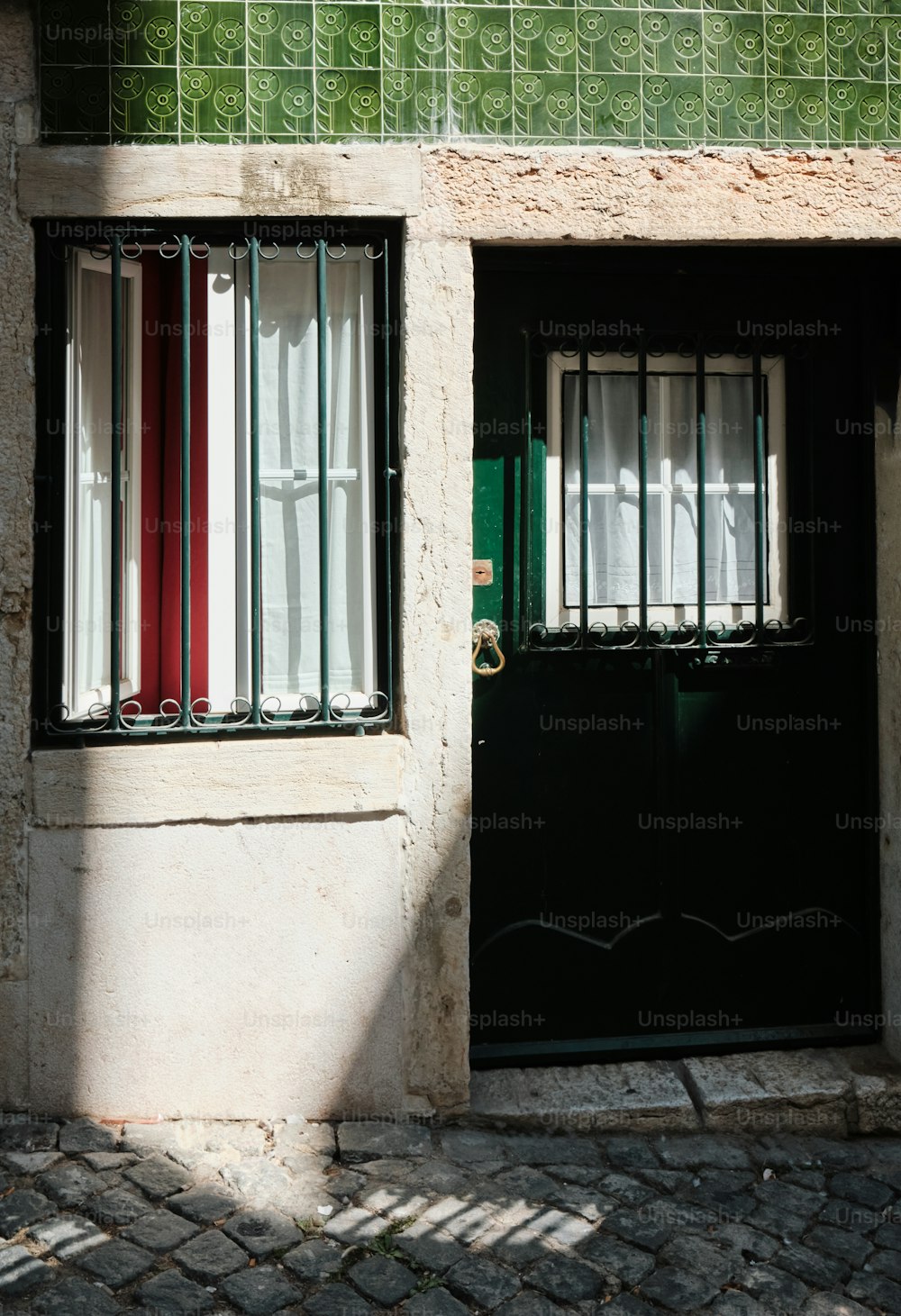 a building with two doors and a window