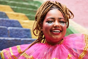 a woman wearing a pink and gold costume