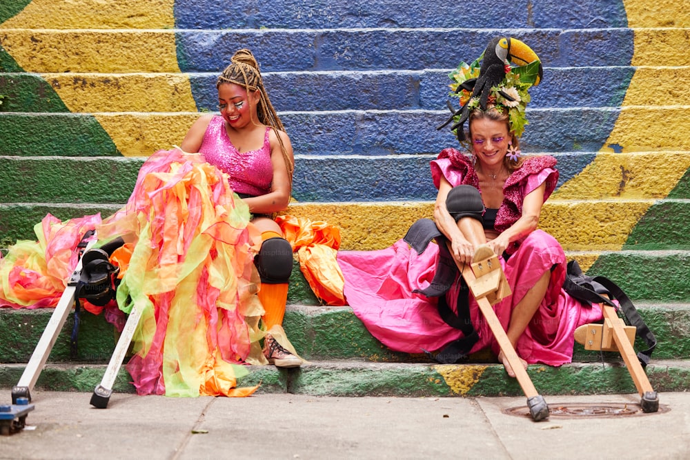 a couple of women sitting next to each other