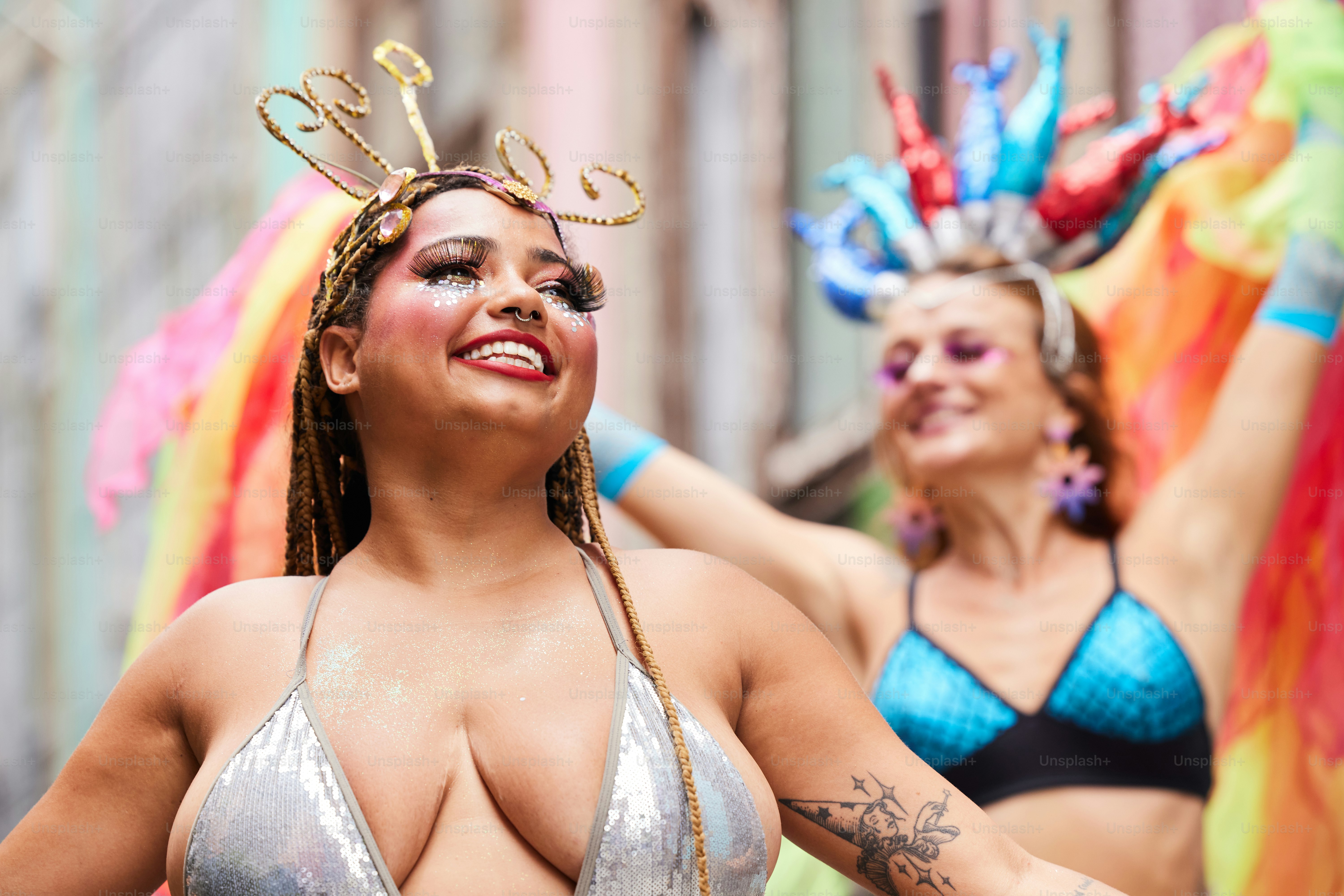 a woman in a bikini top and other women in bikinis