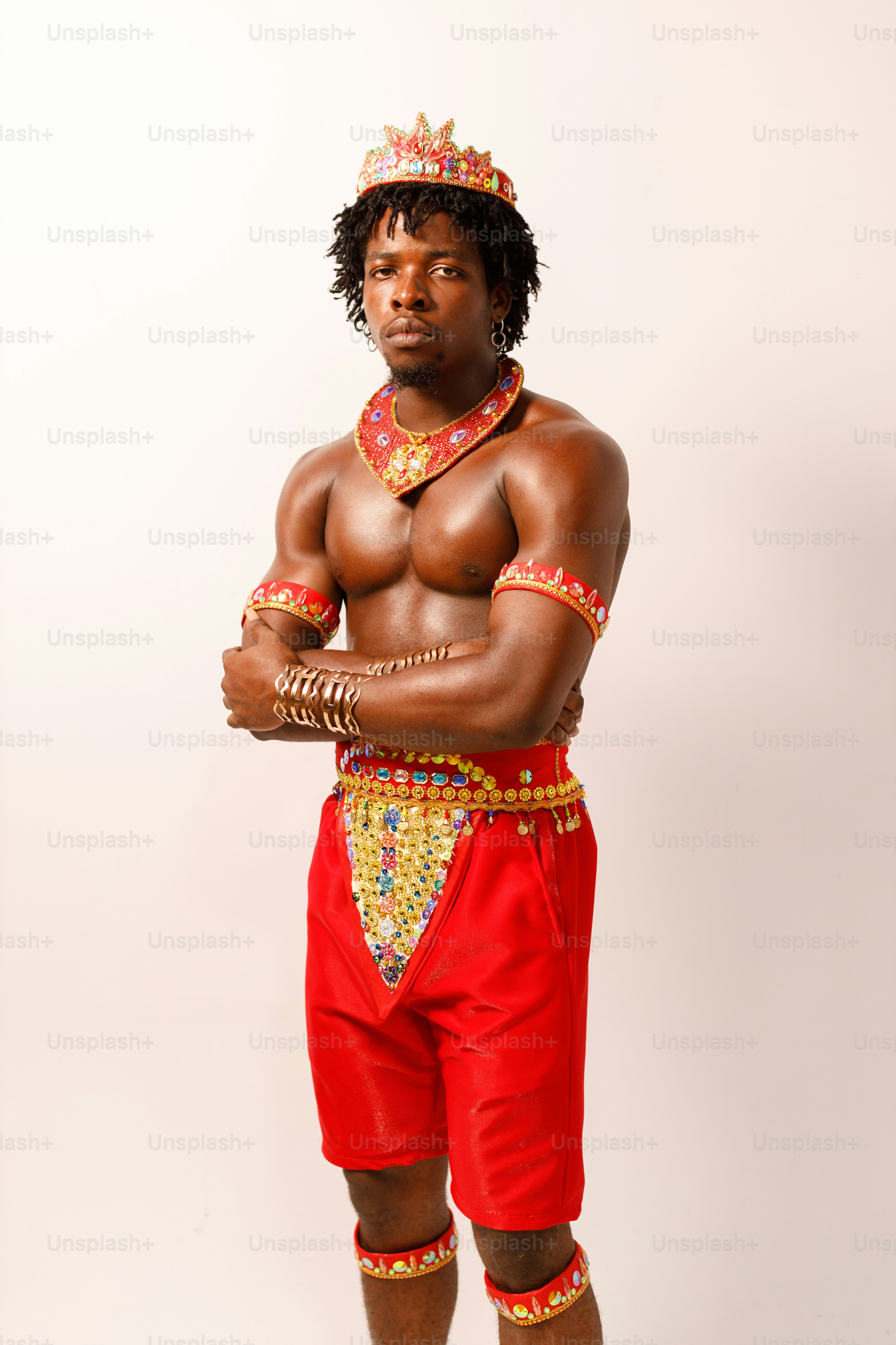 a man in a red and gold costume