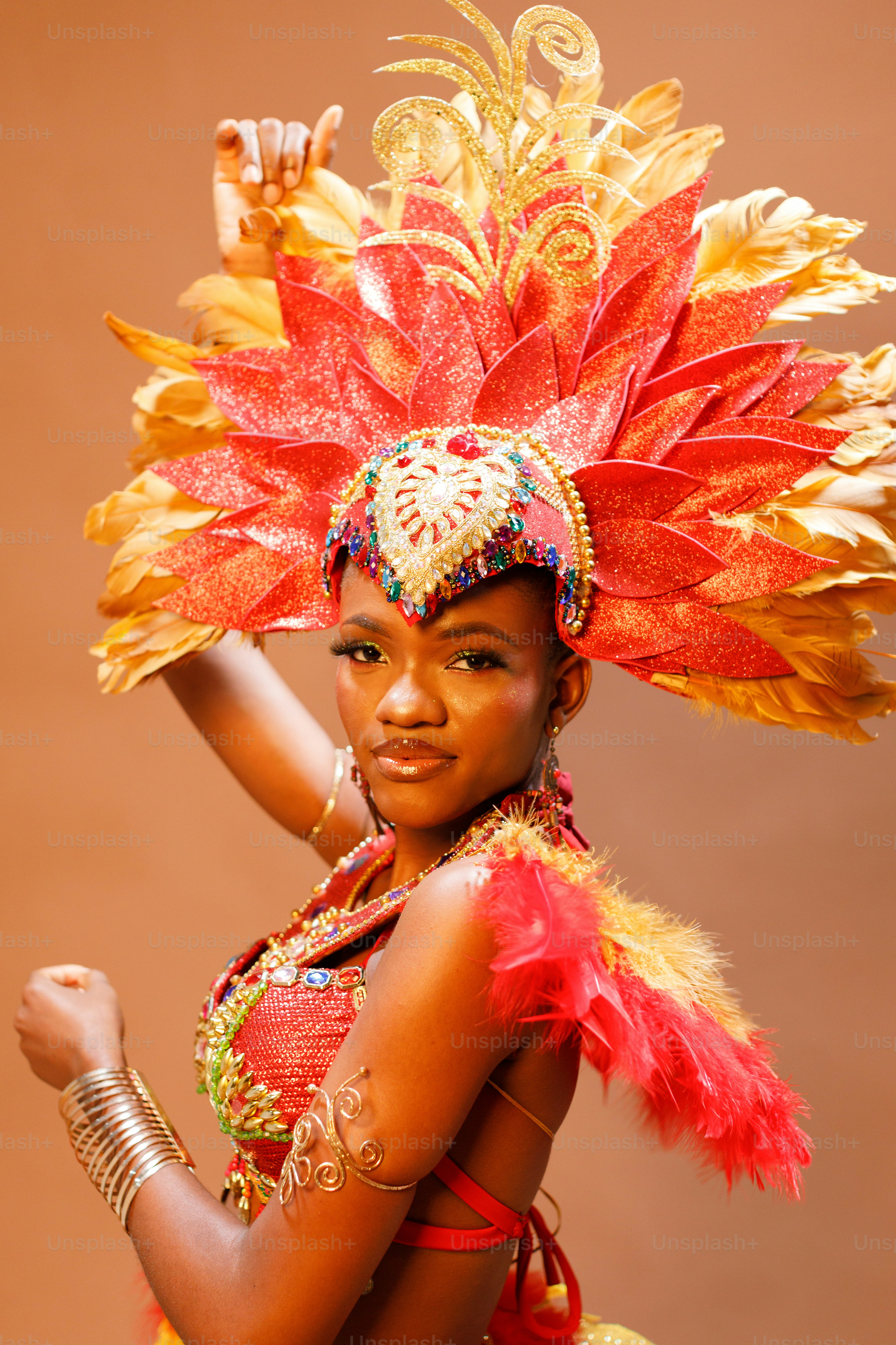 A woman in a red and gold costume photo Rio carnival Image on Unsplash