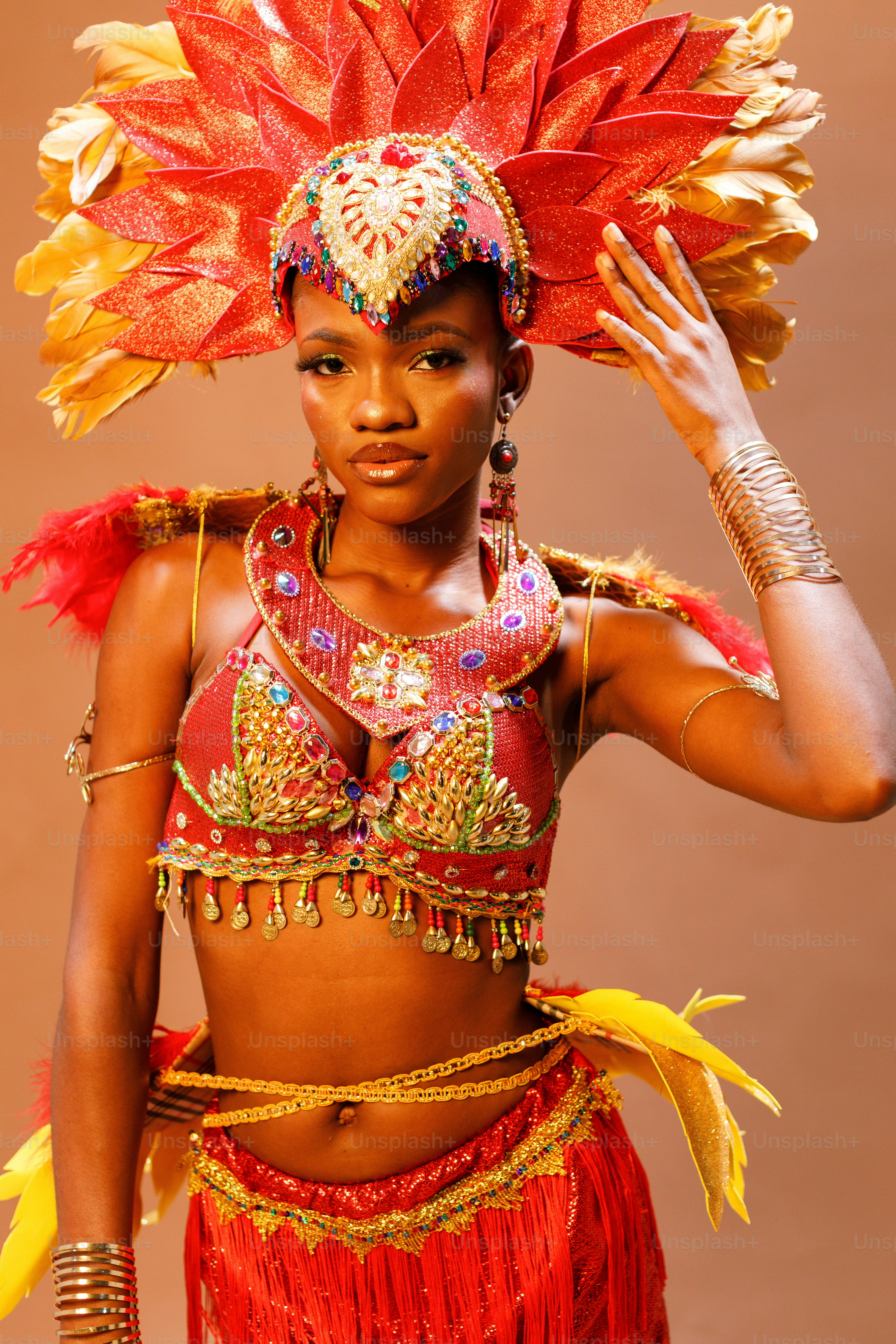 a woman in a red and gold costume