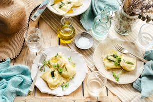 a wooden table topped with plates of food