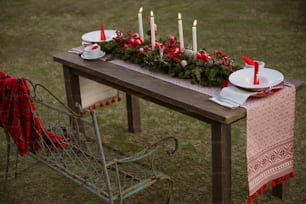 a table with candles and plates on it