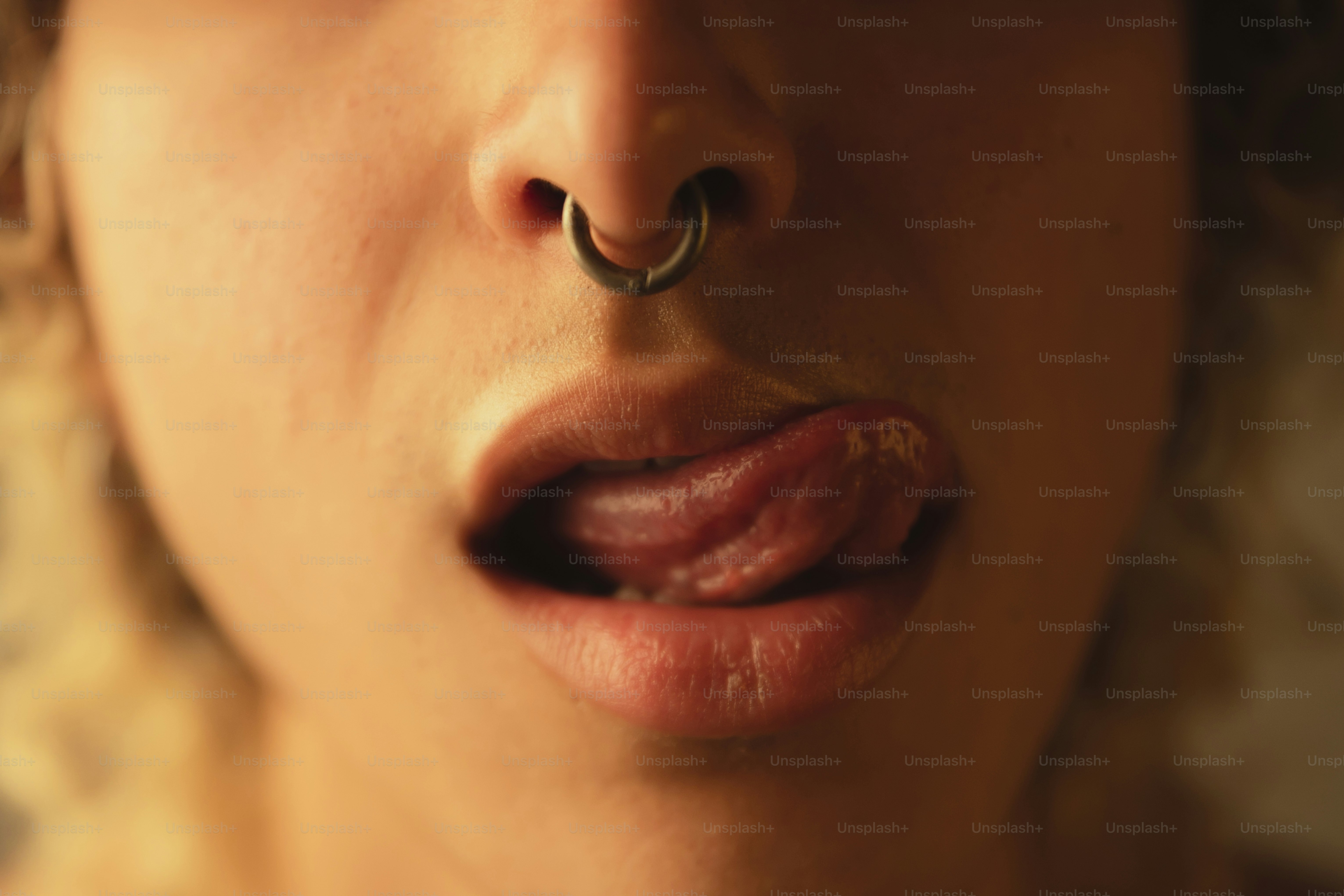 a close up of a person with a nose ring