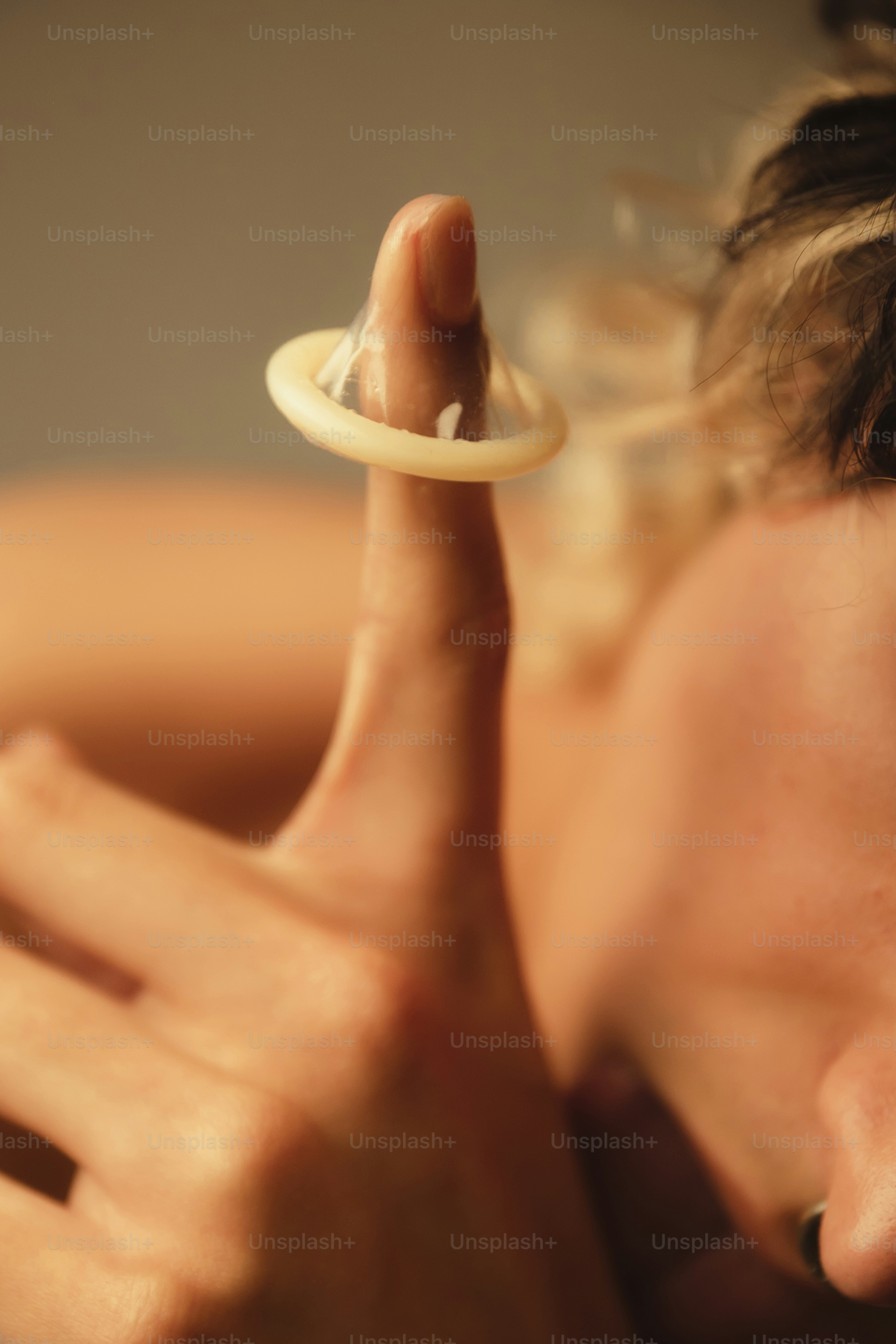 a close up of a person holding a small object