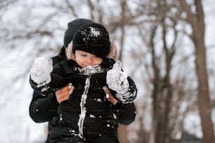 a young child is playing in the snow