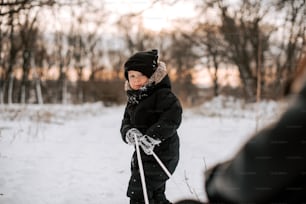 a small child on skis in the snow