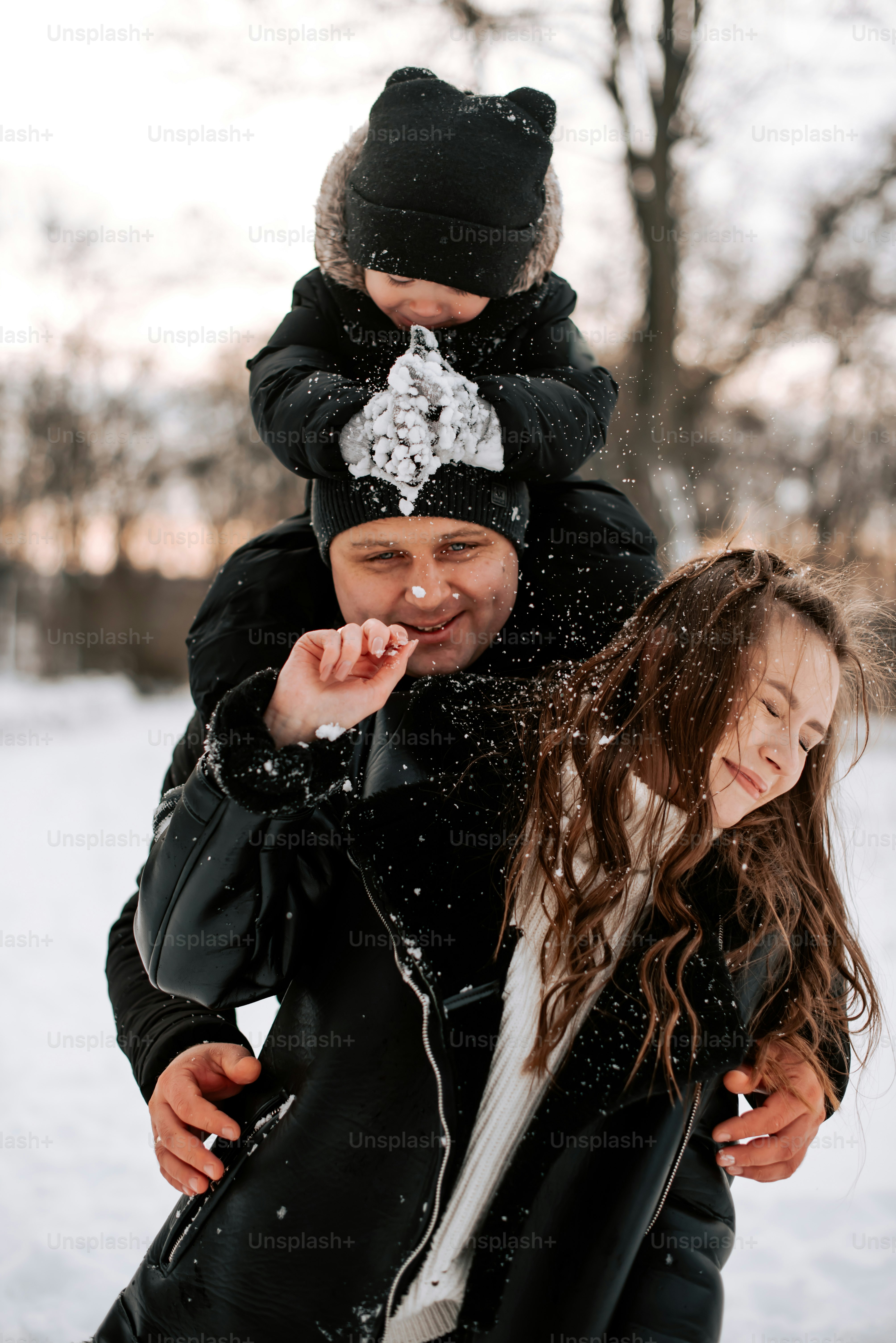 a man and a woman standing in the snow